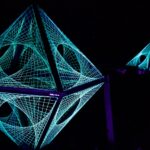 Geometric structures glow in the darkness.