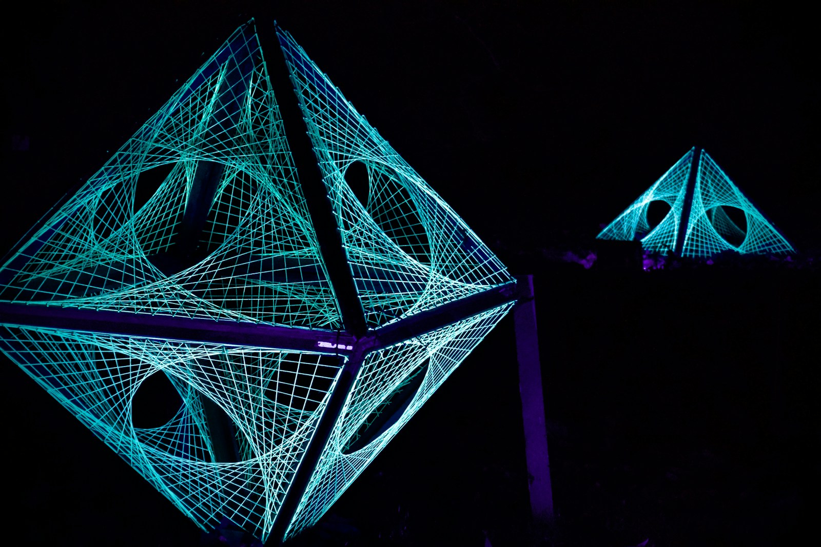 Geometric structures glow in the darkness.