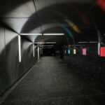 black and white tunnel with lights turned on during nighttime